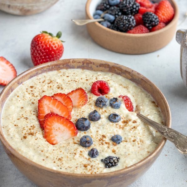 Protein oatmeal with fresh berries, one of the recipes in Protein Packed