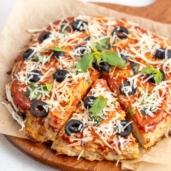 Chicken crust pizza with olives and basil, from Protein Packed