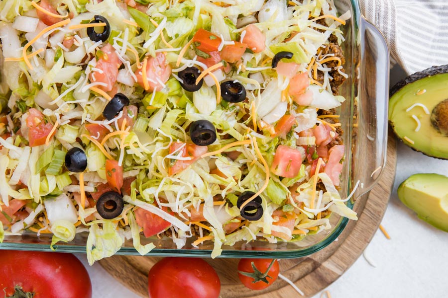 a large casserole dish with a mexican dip instide