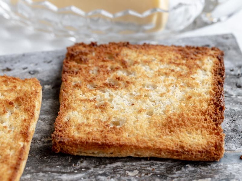 a crunchy piece of keto toast on a slate board
