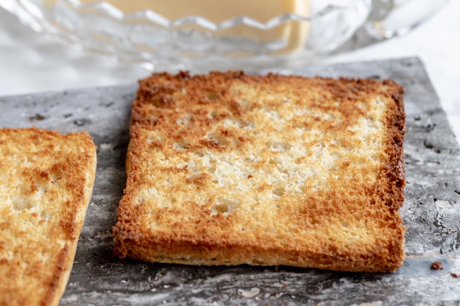 a crunchy piece of keto toast on a slate board