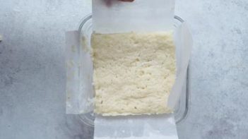 baked white bread in a dish lined with parchment paper