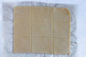 dough cut into 9 equal squares - 3x3 grid of dough