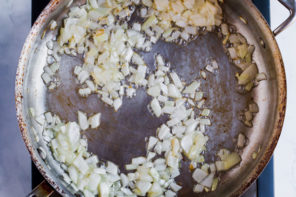 onions sautéing with butter in a sauce pan