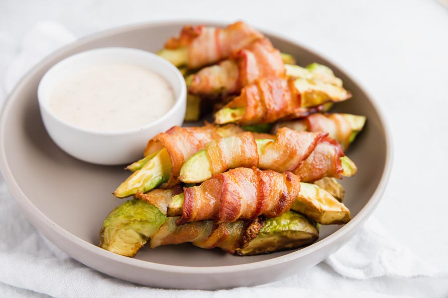 crispy bacon wrapped around thick slices of avocado