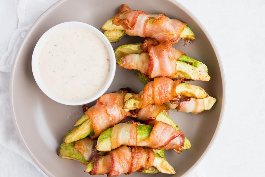 bacon wrapped avocado fries on an appetizer plate