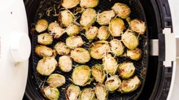 brussels sprouts cooked in the air fryer and topped with cheese