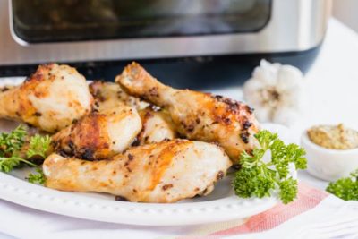 keto chicken sits in front of an air fryer