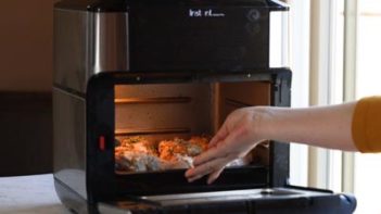 sliding chicken into the air fryer