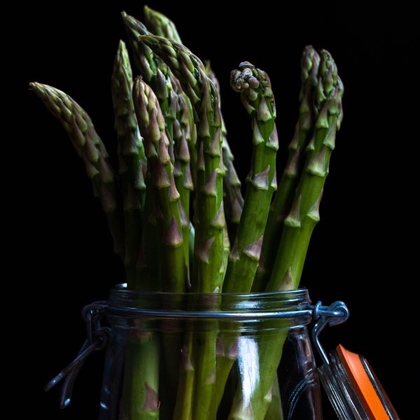 asparagus spears in a glass jar