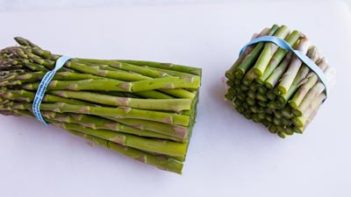 trimmed asparagus on a cutting board