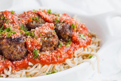 keto meatballs on a plate of spaghetti with marinara sauce