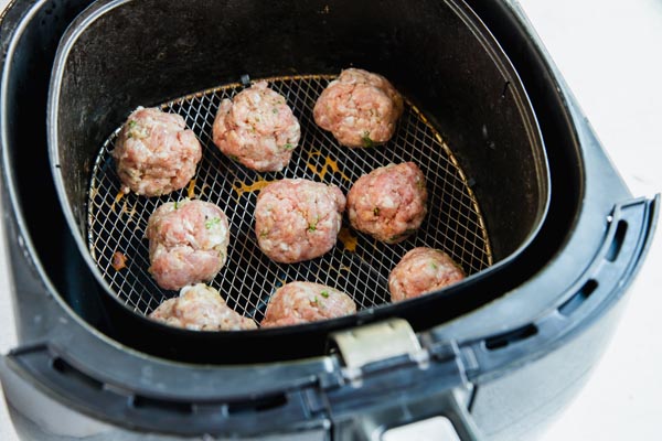 keto meatballs in an air fryer basket