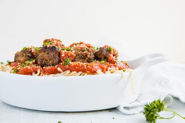 keto meatballs on top of low carb spaghetti noodles and pasta sauce