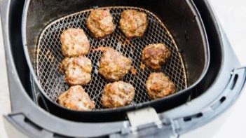 air fried low carb meatballs in an air fryer basket