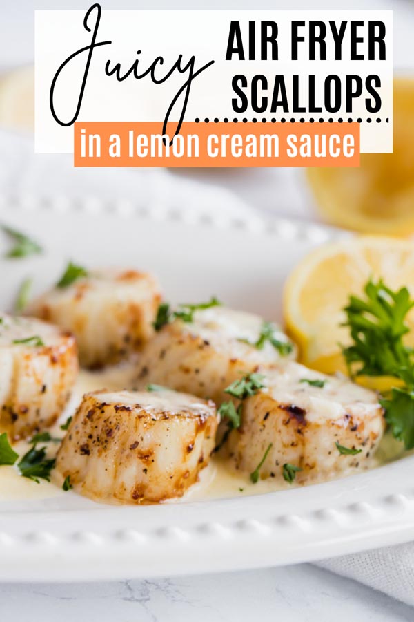 juicy scallops with lemon sauce on a white plate