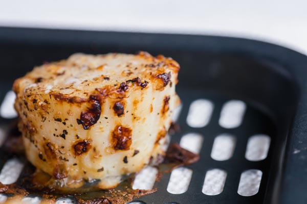 a juicy scallop on an air fryer tray