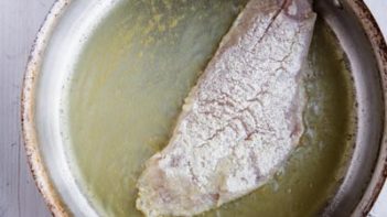 almond flour dusted rockcod fillet in the frying pan