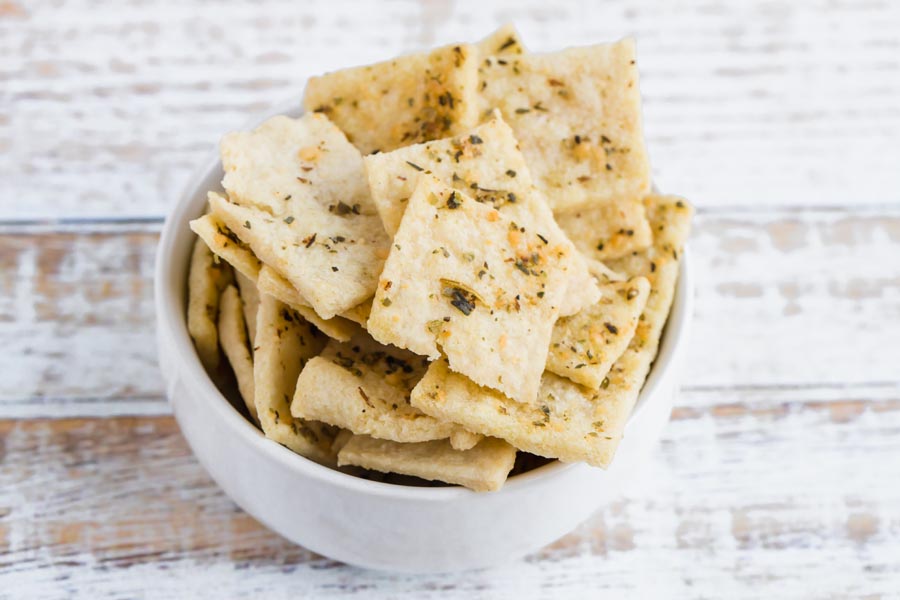 a white bowl filled with keto crackers