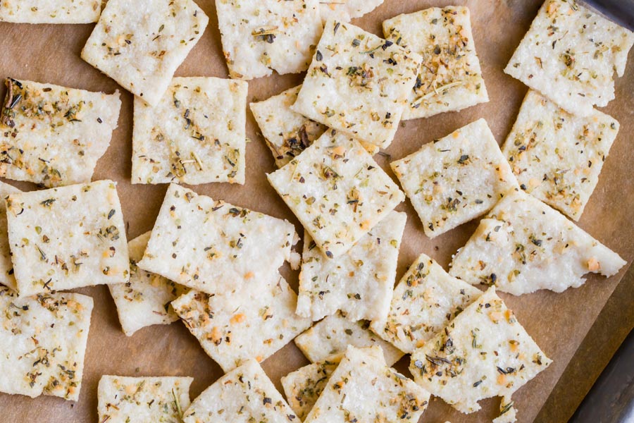 a bunch of crackers laid out on a baking tray