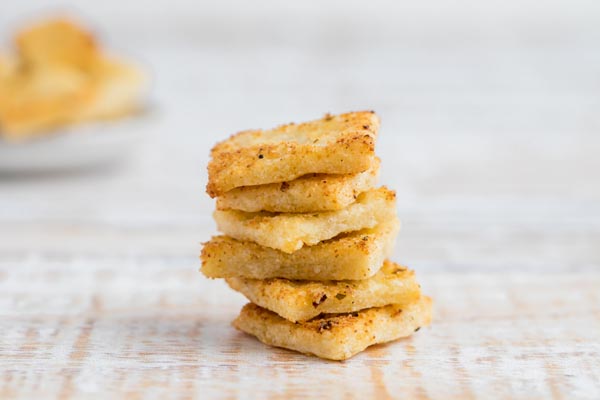 a stack of crispy keto crackers