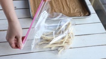 placing frozen fries in a ziploc bag