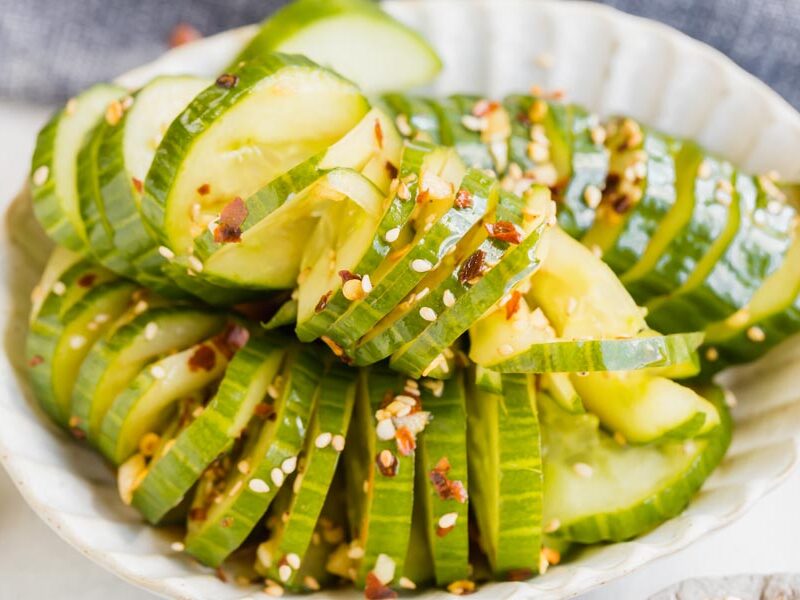 close up of asian marinated cucumbers in a bowl