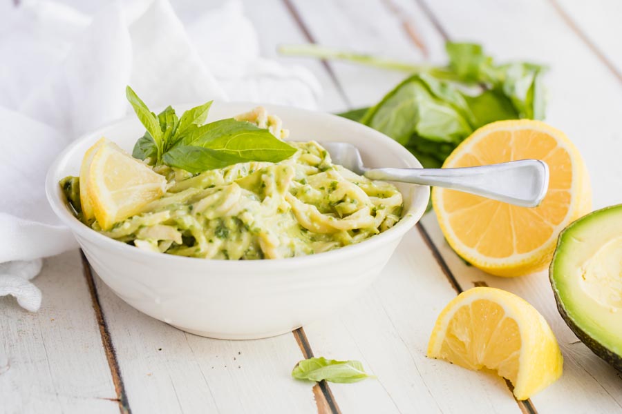 digging into pesto pasta with a fork