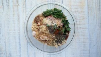 meatball ingredients in a clear glass bowl