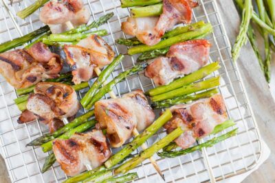 juicy balls of bacon threaded between bites of asparagus on wood skewers