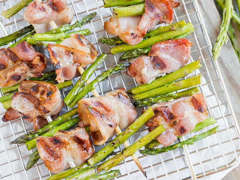 juicy balls of bacon threaded between bites of asparagus on wood skewers