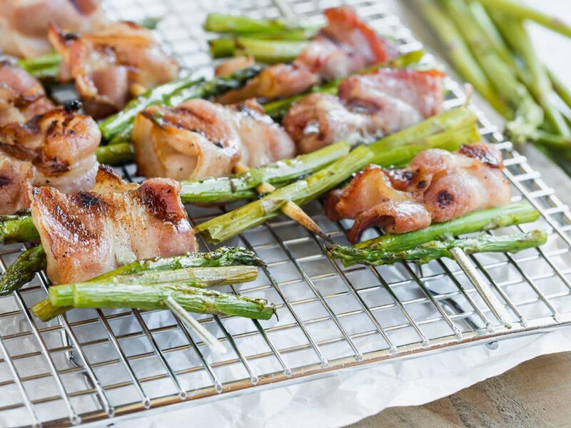 bacon and asparagus kebabs on a wire rack