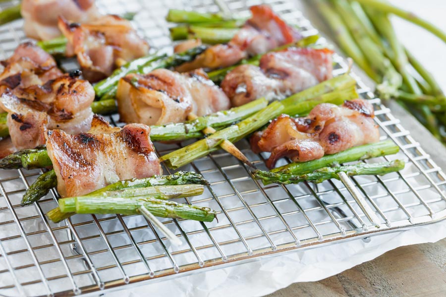 bacon and asparagus kebabs on a wire rack