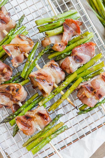 grilled bacon and asparagus kebabs on a cooling rack