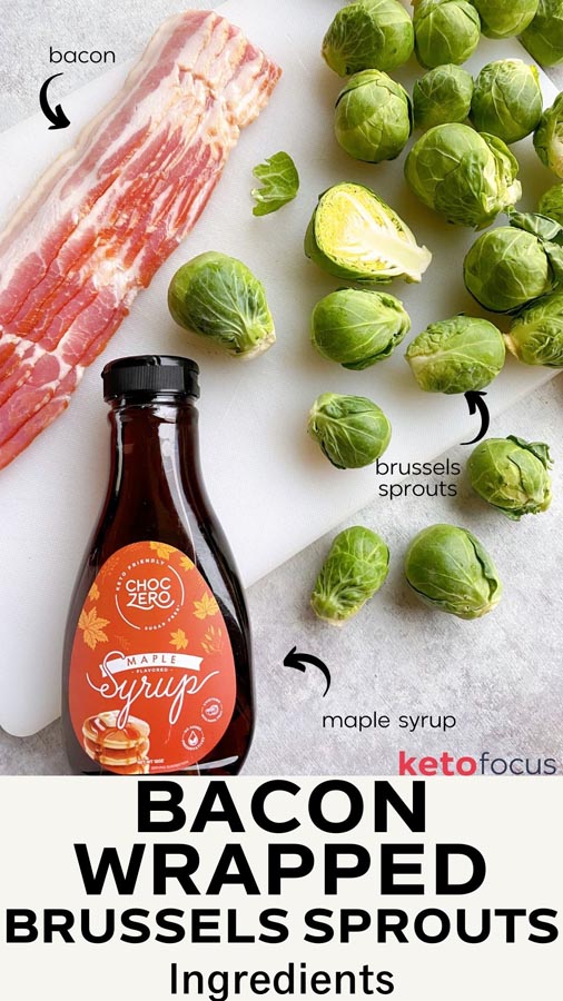 ingredients on a cutting board including bacon, fresh brussels sprouts and a bottle of maple syrup