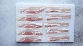 10 half strips of bacon on a cutting board