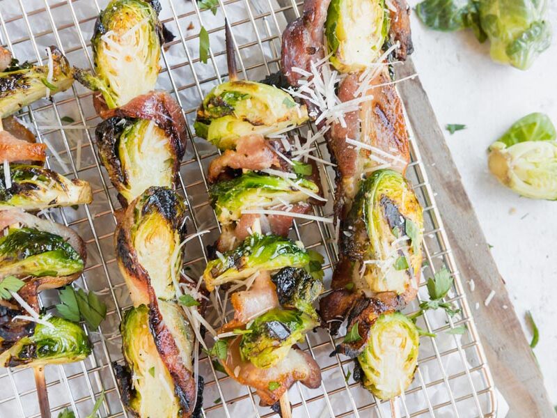bacon and brussels sprouts kebabs covered with parmesan cheese