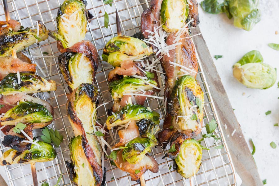 bacon and brussels sprouts kebabs covered with parmesan cheese