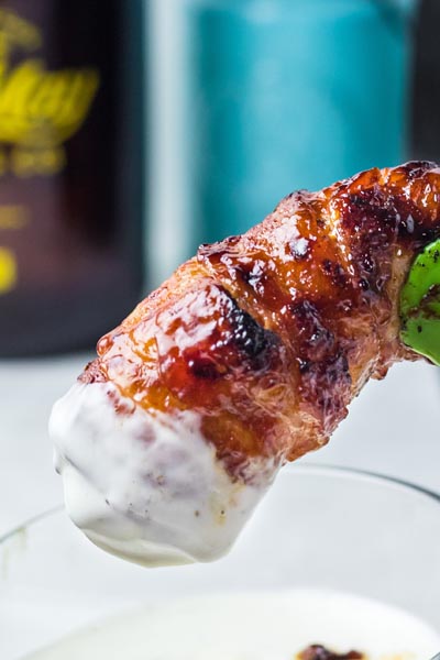 A bacon wrapped tender dipped in ranch dressing.