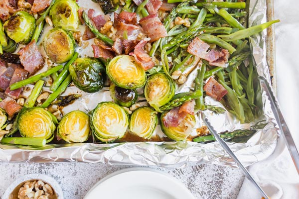 grabbing roasted vegetables with tongs