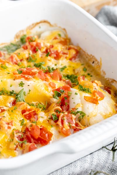 a cheesy fish casserole in a baking dish