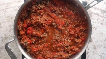 beef marinara sauce cooking in a skillet
