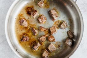 seared beef tips in a skillet