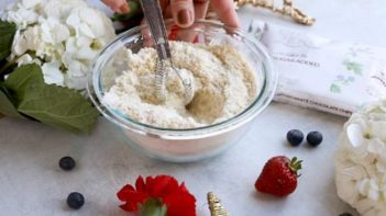 whisking flours with a wire whisk in a small bowl