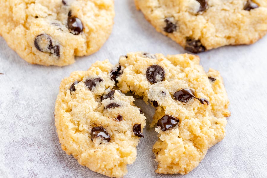 a cookie pulled apart showing the melted chips