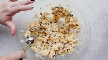 scooping out cookie dough with a cookie scoop