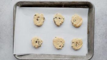 chocolate chip cookie dough on a baking sheet