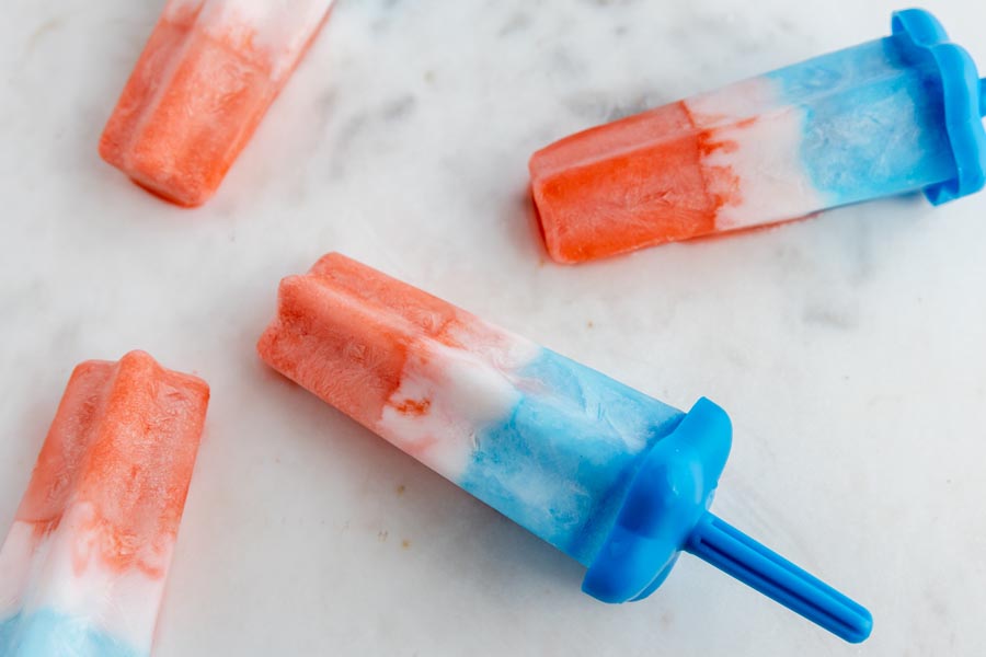 popsicles melting on a white counter