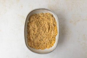 A shallow plate with a low carb breadcrumb mixture.