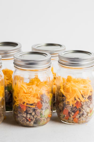 Homemade Jimmy Dean breakfast in meal prep jars stacked next to each other.